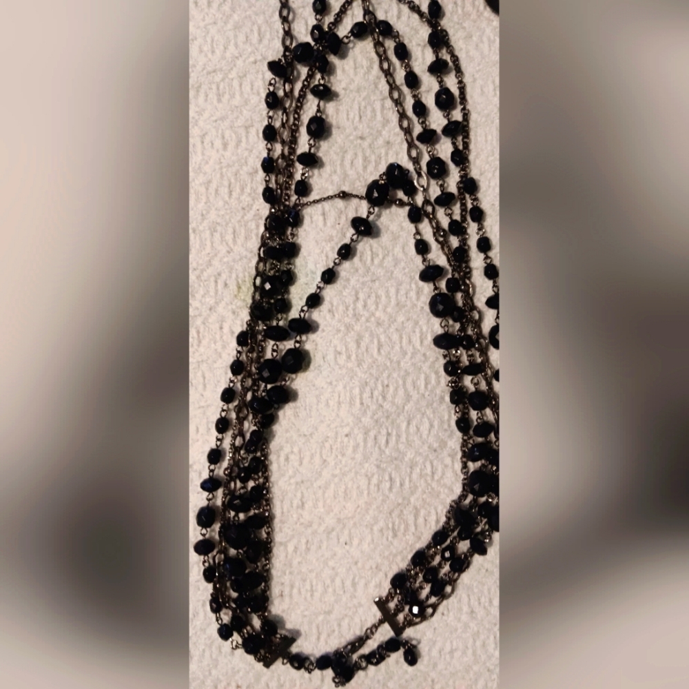 Dark glamorous color coordinated set of costume jewelry.